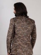 Man wearing a patterned jacket on a plain background
