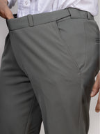 Gray pinstripe dress pants with a white shirt on a neutral background